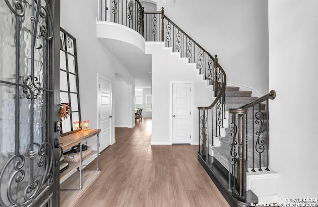 2818 Tortuga Verde, San Antonio, TX 78245 - foyer with a high ceiling, stairway, wood finished floors, and baseboards