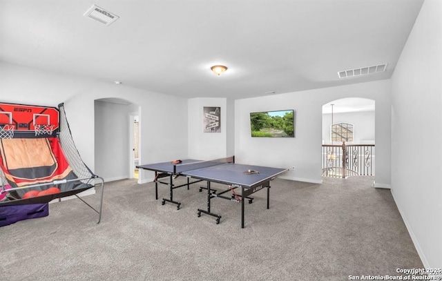 2818 Tortuga Verde, San Antonio, TX 78245 - rec room with arched walkways, carpet flooring, and baseboards
