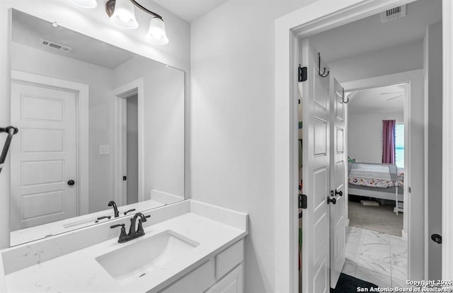 2818 Tortuga Verde, San Antonio, TX 78245 - bathroom featuring marble look tile flooring, vanity, and ensuite bathroom