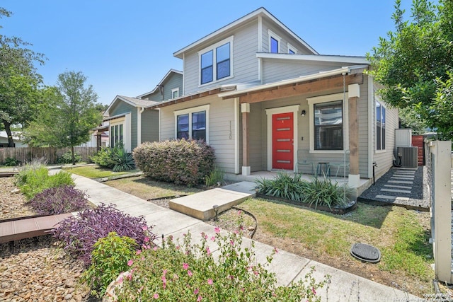 1130 N Olive St, San Antonio, TX 78202 - view of front facade featuring covered porch and central AC