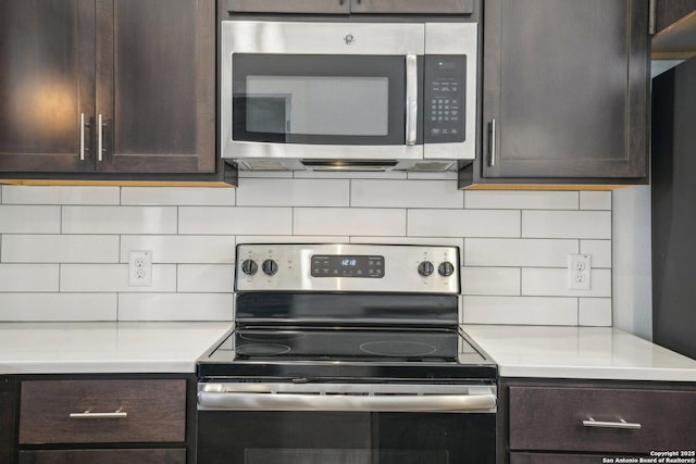 1130 N Olive St, San Antonio, TX 78202 - kitchen featuring appliances with stainless steel finishes, dark brown cabinetry, and decorative backsplash