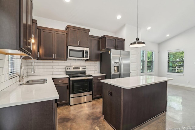1130 N Olive St, San Antonio, TX 78202 - kitchen featuring appliances with stainless steel finishes, a sink, concrete floors, decorative backsplash, and dark brown cabinetry
