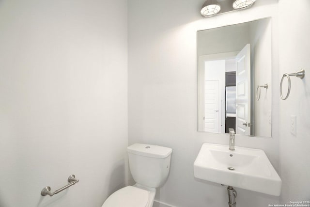 1130 N Olive St, San Antonio, TX 78202 - bathroom featuring toilet and a sink