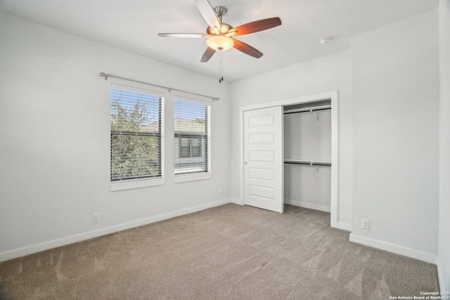 1130 N Olive St, San Antonio, TX 78202 - unfurnished bedroom featuring carpet flooring, baseboards, a closet, and ceiling fan