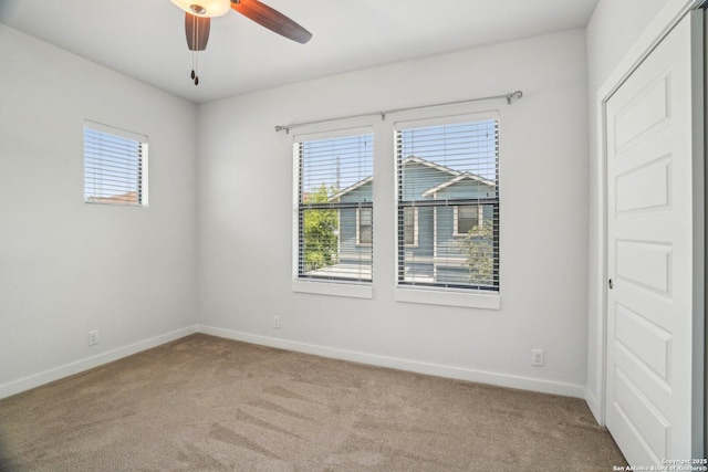 1130 N Olive St, San Antonio, TX 78202 - unfurnished room featuring carpet floors, baseboards, and ceiling fan