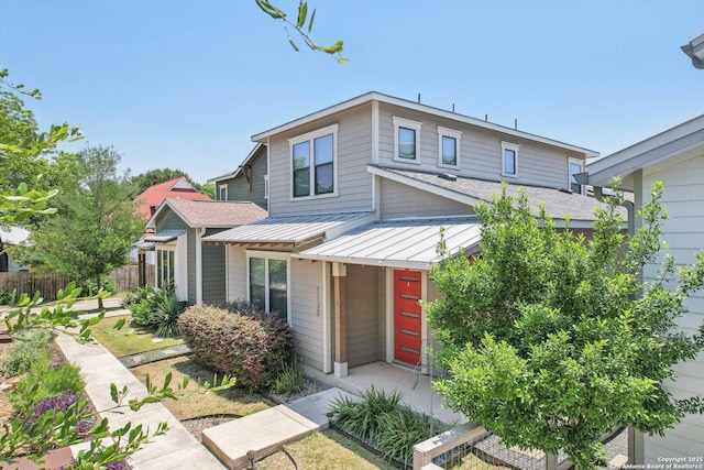 1130 N Olive St, San Antonio, TX 78202 - view of front of home featuring a standing seam roof, metal roof, and roof with shingles