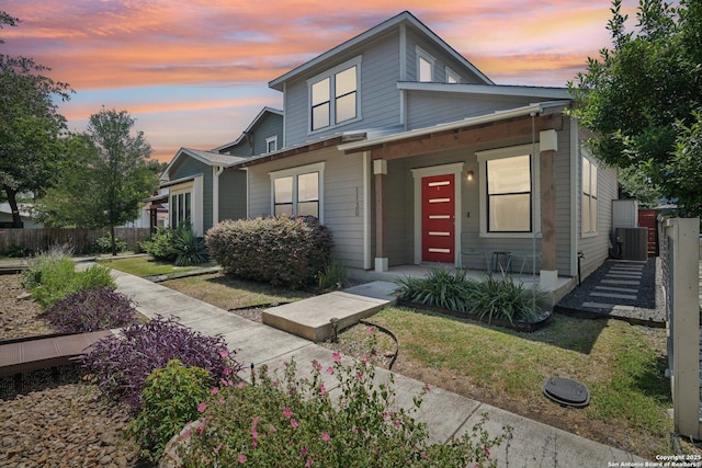1130 N Olive St, San Antonio, TX 78202 - view of front of home featuring a porch and central AC unit