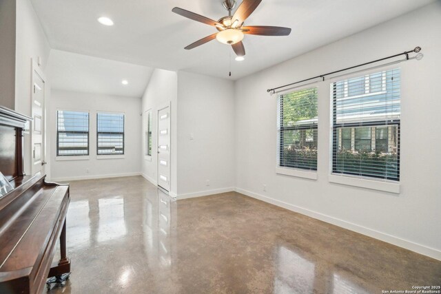 1130 N Olive St, San Antonio, TX 78202 - unfurnished living room with concrete floors, a ceiling fan, baseboards, and recessed lighting