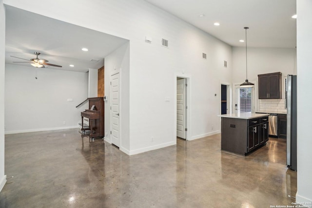 1130 N Olive St, San Antonio, TX 78202 - kitchen with concrete floors, ceiling fan, recessed lighting, a kitchen island, and light countertops