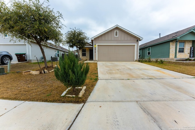 9815 Marbach Gdn, San Antonio, TX 78245 - view of front facade with board and batten siding, concrete driveway, a garage, and central air condition unit