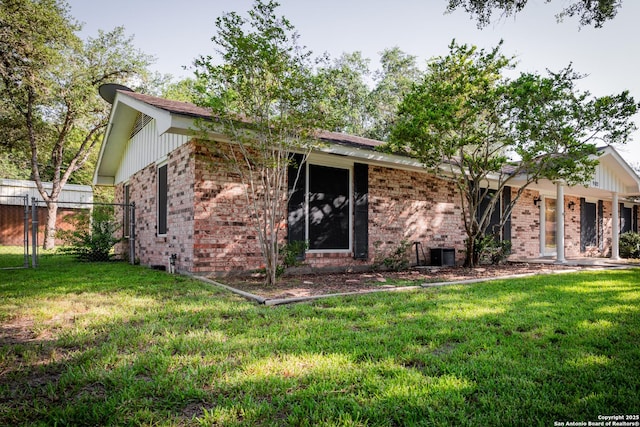 902 Newhall, Beeville, TX 78102 - back of house featuring brick siding