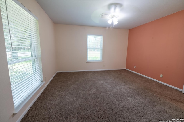 902 Newhall, Beeville, TX 78102 - empty room with a ceiling fan, carpet flooring, and baseboards