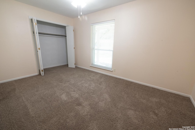 902 Newhall, Beeville, TX 78102 - unfurnished bedroom featuring carpet, a closet, and baseboards