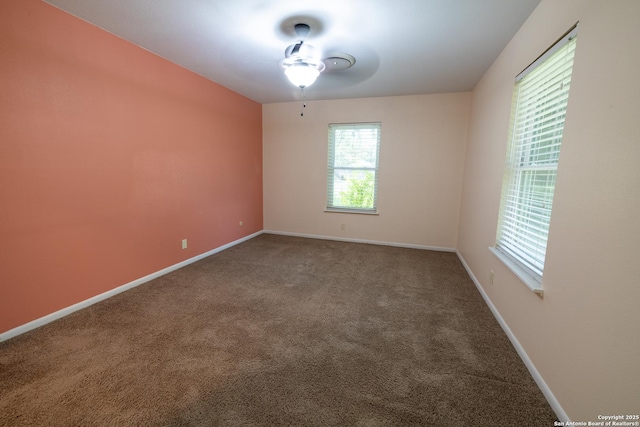 902 Newhall, Beeville, TX 78102 - empty room with ceiling fan, carpet floors, and baseboards