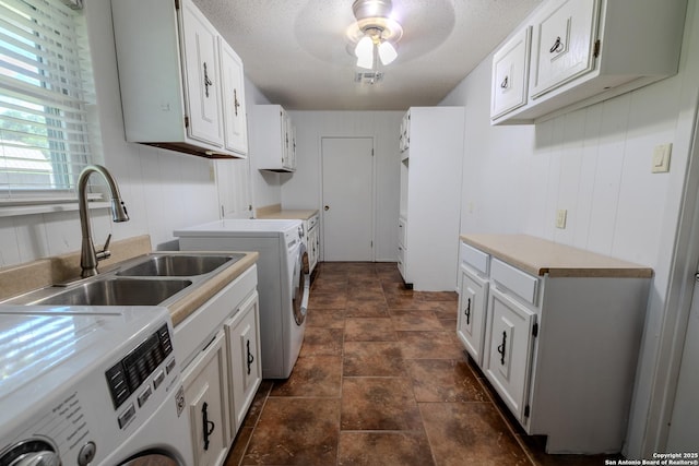 902 Newhall, Beeville, TX 78102 - laundry room featuring a sink, separate washer and dryer, stone finish floors, a textured ceiling, and ceiling fan