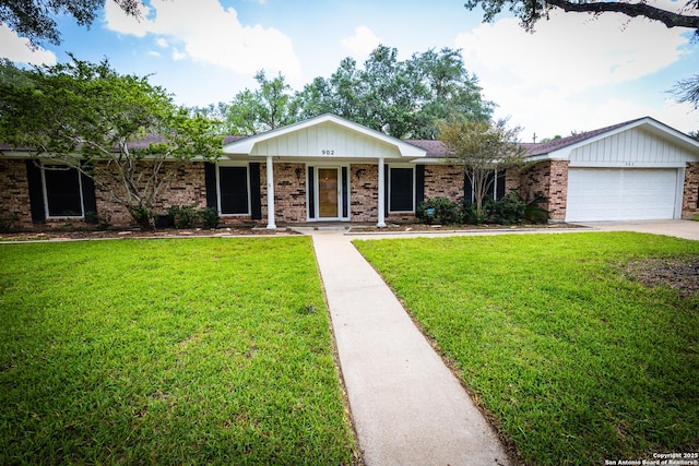 902 Newhall, Beeville, TX 78102 - single story home with a front yard, a garage, brick siding, and concrete driveway