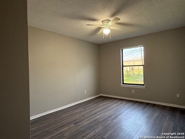 130 Nedrub Dr, San Antonio, TX 78223 - unfurnished room with a ceiling fan, dark wood-type flooring, a textured ceiling, and baseboards