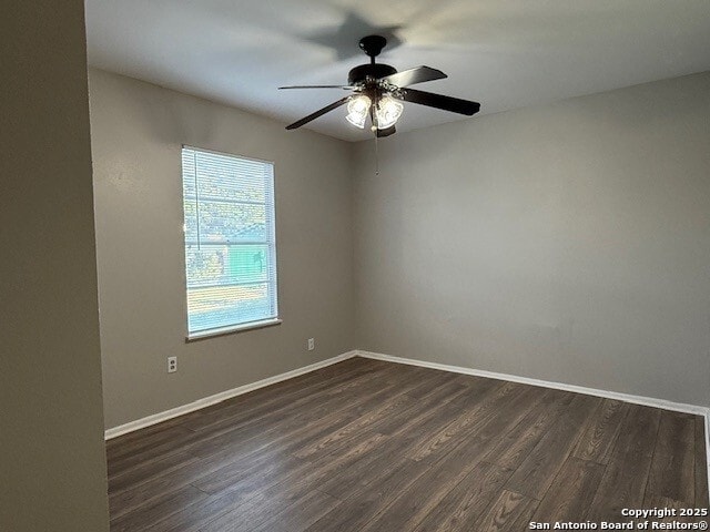 130 Nedrub Dr, San Antonio, TX 78223 - empty room featuring ceiling fan, dark wood finished floors, and baseboards