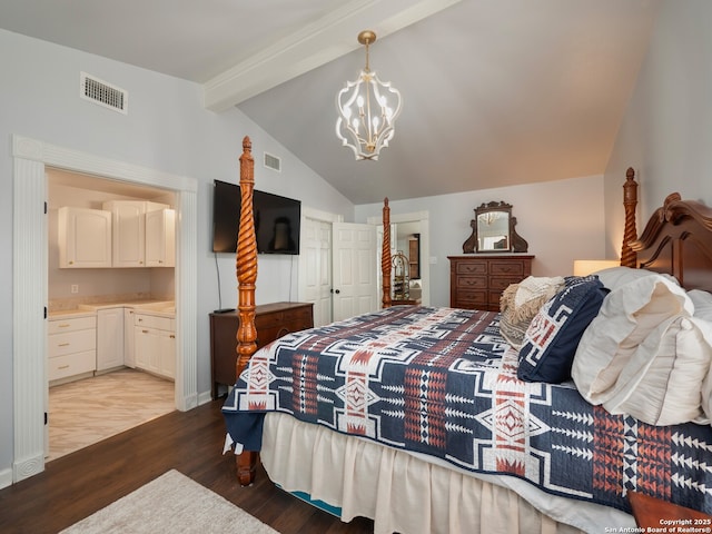 2275 Huber Rd, Seguin, TX 78155 - bedroom with wood finished floors, a chandelier, connected bathroom, and a closet