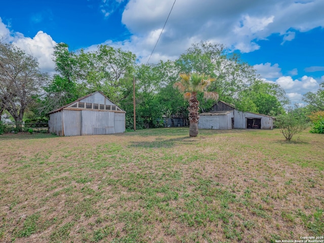 2275 Huber Rd, Seguin, TX 78155 - view of yard featuring an outbuilding, an outdoor structure, and a garage