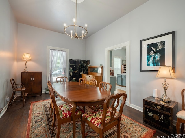 2275 Huber Rd, Seguin, TX 78155 - dining space featuring a chandelier, dark wood finished floors, baseboards, and vaulted ceiling
