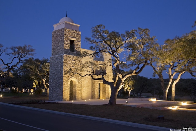 441 Vamanos, Boerne, TX 78006 - property exterior at night featuring stone siding