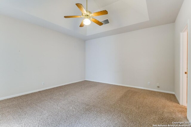 2614 Inwood Vw, San Antonio, TX 78248 - unfurnished room with carpet, a ceiling fan, baseboards, and a tray ceiling