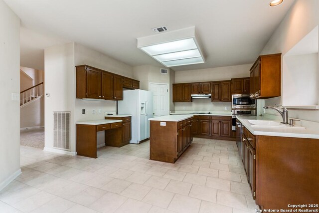 2614 Inwood Vw, San Antonio, TX 78248 - kitchen with appliances with stainless steel finishes, a sink, light countertops, a kitchen island, and baseboards
