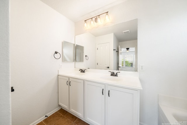 10911 Shoo Fly Trl, San Antonio, TX 78245 - full bath featuring double vanity, baseboards, and tile patterned floors