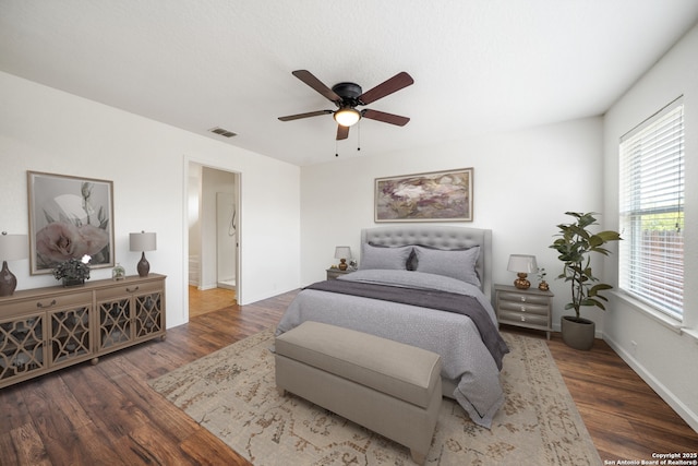 10911 Shoo Fly Trl, San Antonio, TX 78245 - bedroom with wood finished floors, multiple windows, ceiling fan, and baseboards