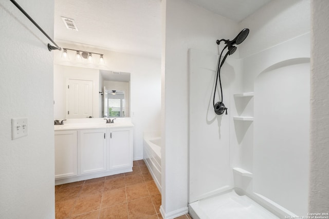 10911 Shoo Fly Trl, San Antonio, TX 78245 - bathroom with a shower, double vanity, and a bath
