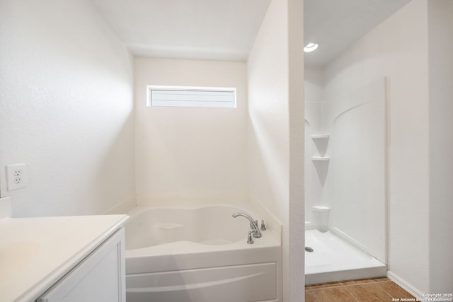 10911 Shoo Fly Trl, San Antonio, TX 78245 - full bath with vanity, a garden tub, and a shower