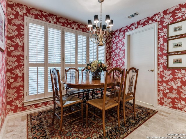 11607 Elm Rdg, San Antonio, TX 78230 - dining space featuring plenty of natural light, a chandelier, wallpapered walls, and baseboards
