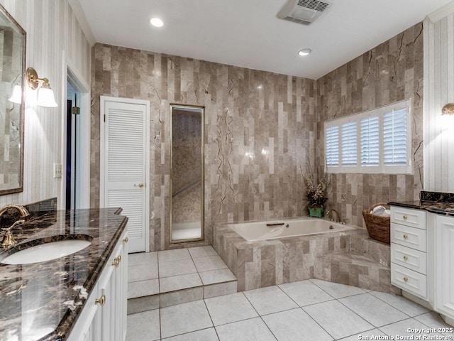 11607 Elm Rdg, San Antonio, TX 78230 - bathroom with vanity, a garden tub, and tile patterned flooring