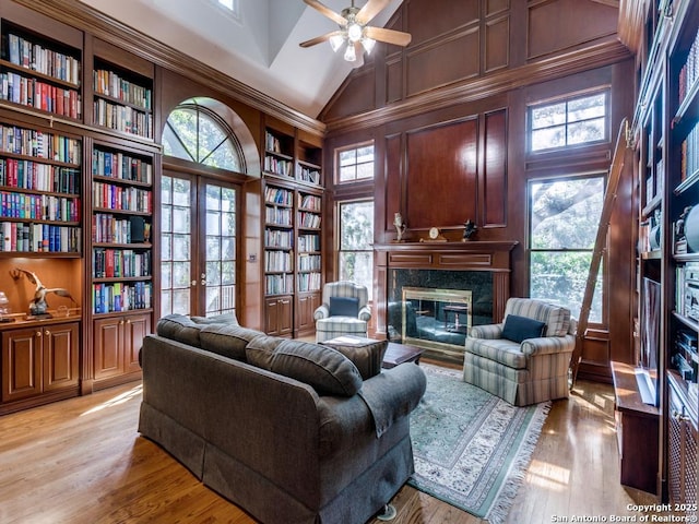 11607 Elm Rdg, San Antonio, TX 78230 - living room with built in features, plenty of natural light, a premium fireplace, a ceiling fan, and high vaulted ceiling
