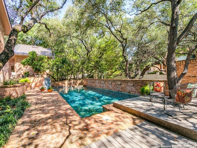 11607 Elm Rdg, San Antonio, TX 78230 - view of swimming pool featuring a deck and a fenced backyard