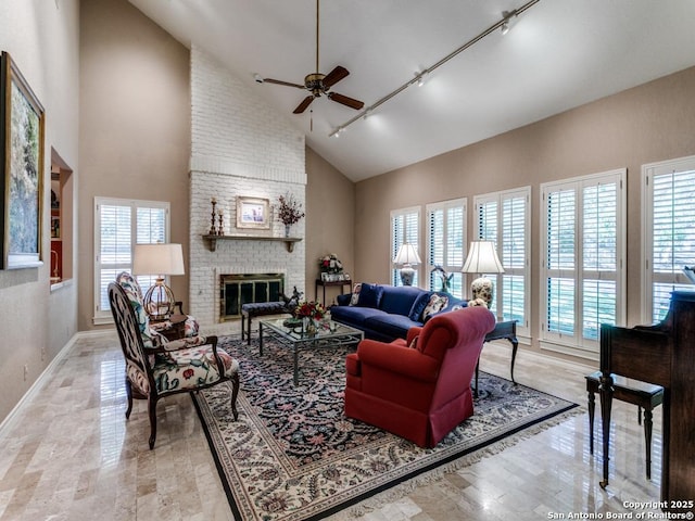 11607 Elm Rdg, San Antonio, TX 78230 - living area featuring rail lighting, a ceiling fan, high vaulted ceiling, baseboards, and a fireplace