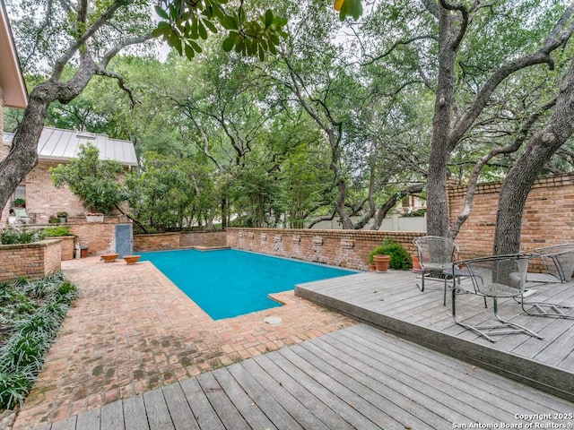 11607 Elm Rdg, San Antonio, TX 78230 - view of swimming pool with a wooden deck, a fenced backyard, and a patio