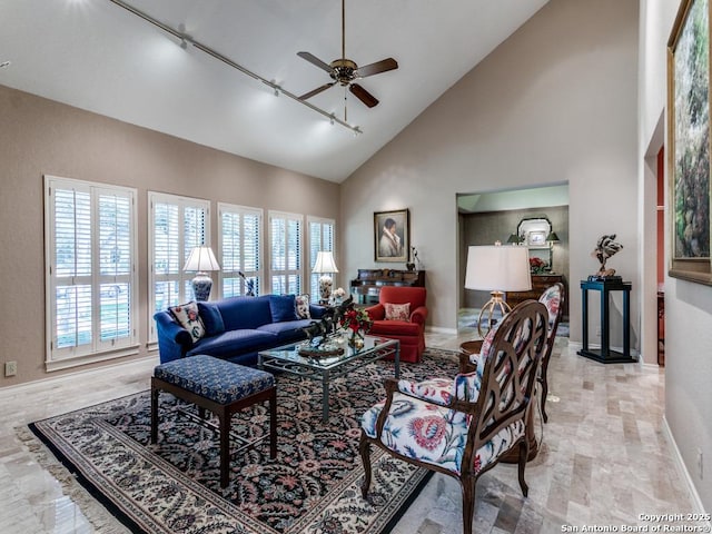 11607 Elm Rdg, San Antonio, TX 78230 - living area featuring track lighting, ceiling fan, high vaulted ceiling, and baseboards