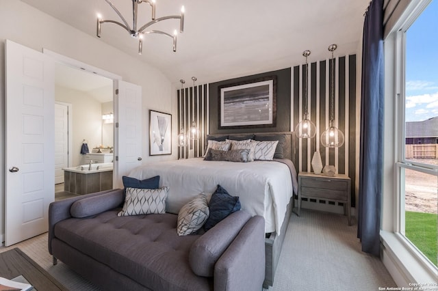 379 Borchers Blvd, New Braunfels, TX 78132 - carpeted bedroom featuring a chandelier, lofted ceiling, and ensuite bath