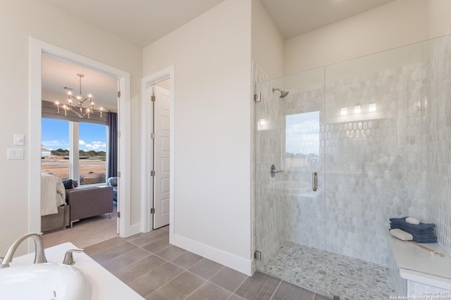 379 Borchers Blvd, New Braunfels, TX 78132 - ensuite bathroom with a shower stall, a chandelier, a sink, and baseboards