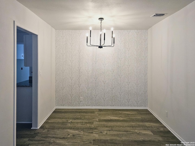 6606 Lake Gln, San Antonio, TX 78244 - unfurnished dining area with wood finished floors, a chandelier, baseboards, and wallpapered walls