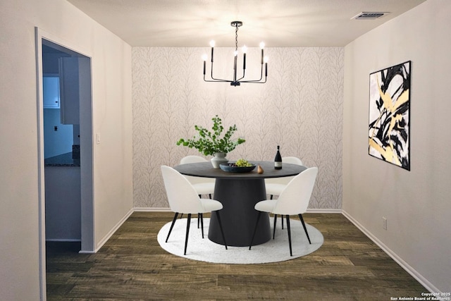 6606 Lake Gln, San Antonio, TX 78244 - dining area with wood finished floors, a chandelier, baseboards, and wallpapered walls
