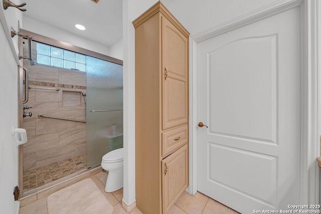 1804 Athens Ave, Kerrville, TX 78028 - full bathroom featuring a shower stall, tile patterned flooring, and toilet