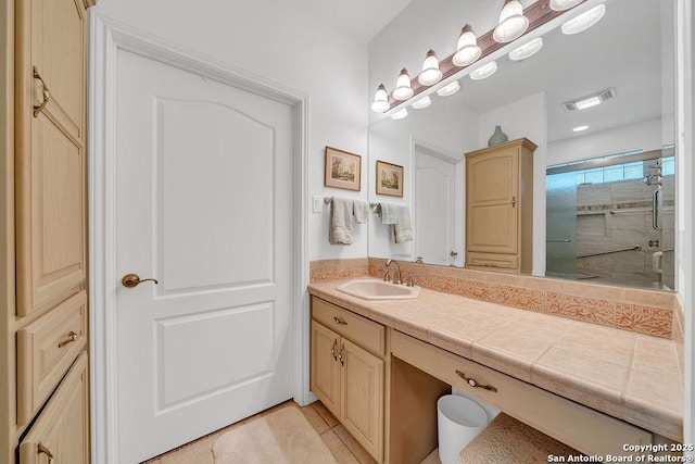 1804 Athens Ave, Kerrville, TX 78028 - bathroom featuring vanity, a shower stall, and tile patterned floors