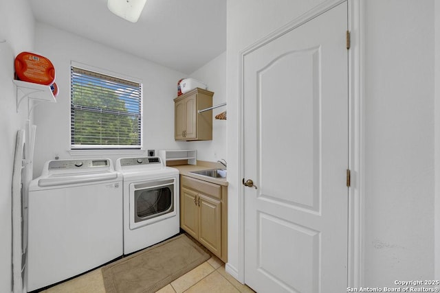 1804 Athens Ave, Kerrville, TX 78028 - washroom featuring cabinet space, independent washer and dryer, and light tile patterned floors