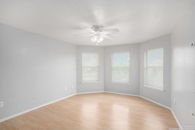 7027 Heathers Way, San Antonio, TX 78227 - empty room with a ceiling fan, light wood-style floors, and baseboards