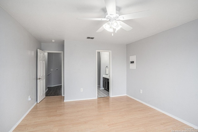 7027 Heathers Way, San Antonio, TX 78227 - unfurnished bedroom with light wood-type flooring, ensuite bathroom, baseboards, and a ceiling fan