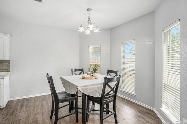 7027 Heathers Way, San Antonio, TX 78227 - dining room featuring dark wood finished floors, baseboards, and a chandelier