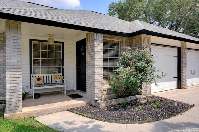 3734 Colter, San Antonio, TX 78247 - view of exterior entry featuring roof with shingles, brick siding, covered porch, and driveway